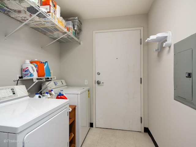 laundry room featuring electric panel and washer and dryer