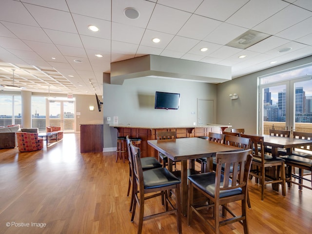 dining area featuring light hardwood / wood-style flooring and french doors