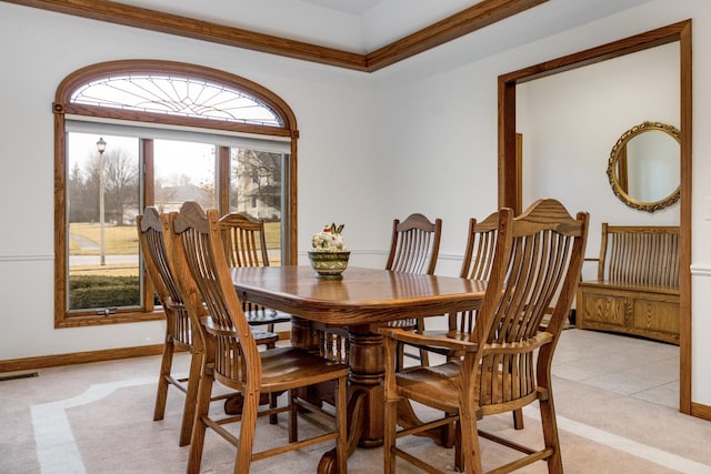 dining space featuring light colored carpet