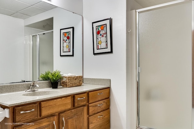 bathroom featuring vanity and an enclosed shower