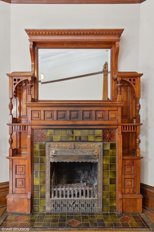 details featuring a tiled fireplace