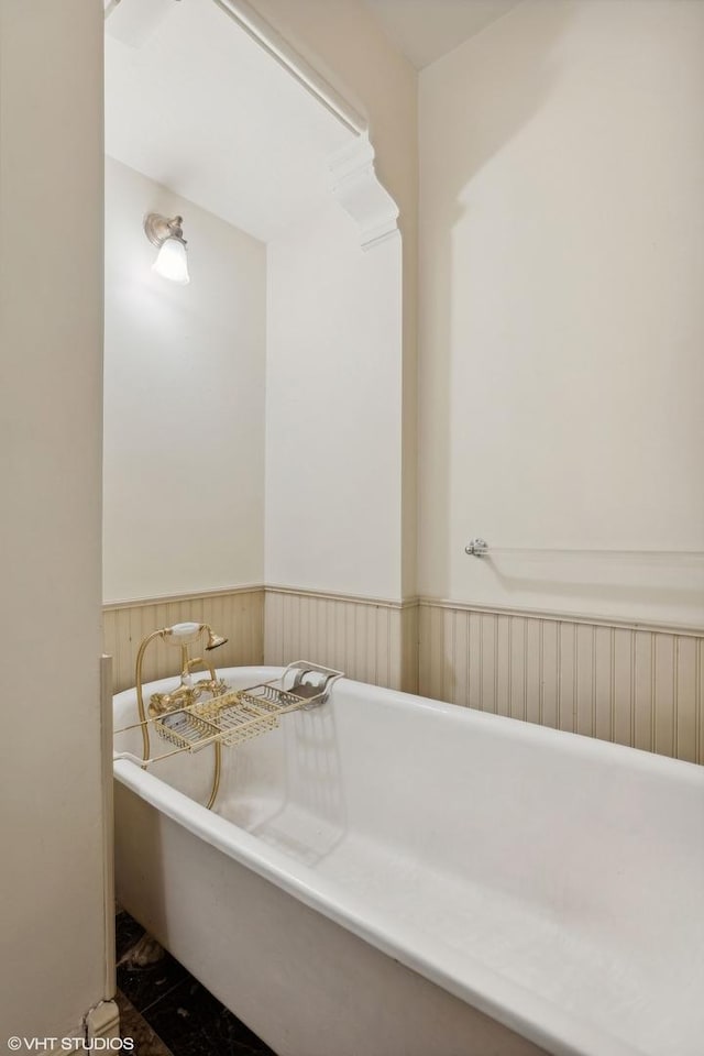 bathroom with a tub to relax in