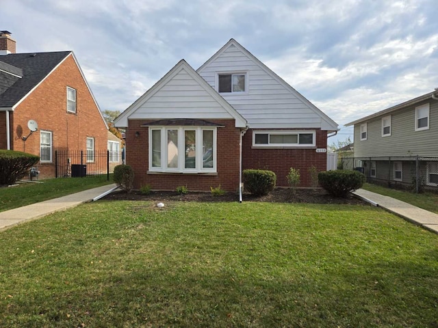 bungalow with a front lawn and cooling unit