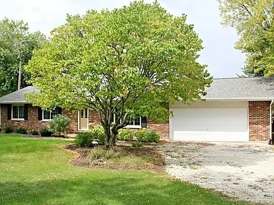 view of front facade with a front lawn and a garage