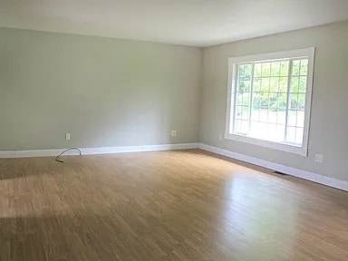 spare room featuring hardwood / wood-style floors