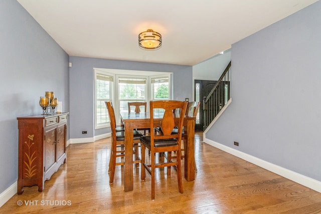 dining space featuring light wood-type flooring