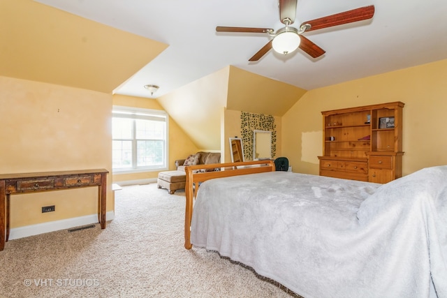 carpeted bedroom with ceiling fan and lofted ceiling