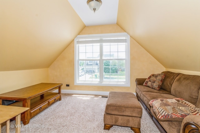 interior space with lofted ceiling and carpet floors