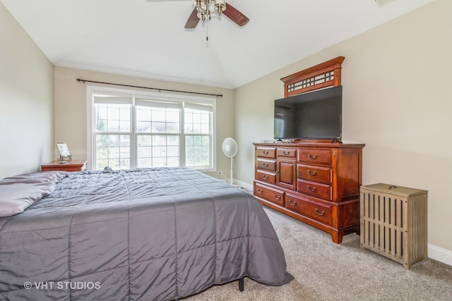 bedroom with lofted ceiling, light carpet, and ceiling fan