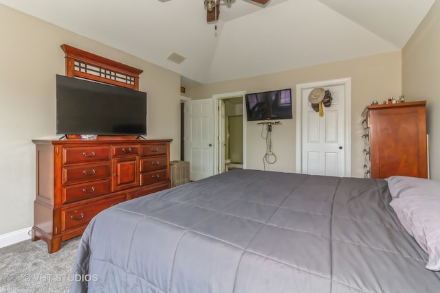 bedroom with ceiling fan, light carpet, and vaulted ceiling