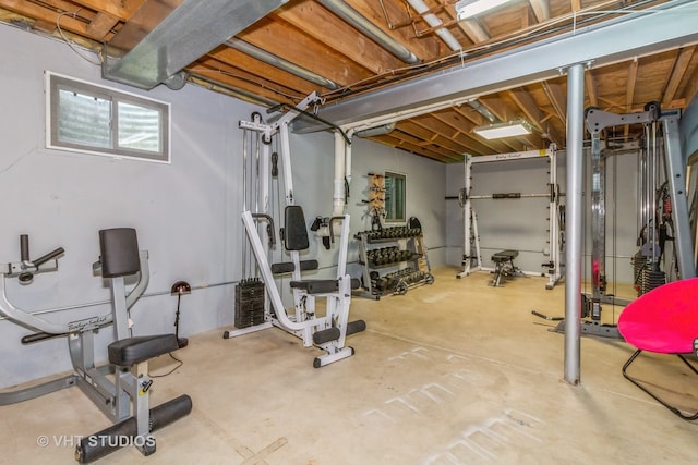 exercise area featuring concrete floors