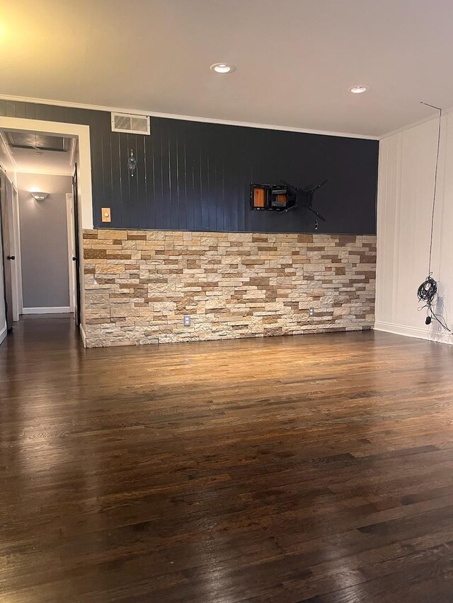 interior space with wood-type flooring and ceiling fan