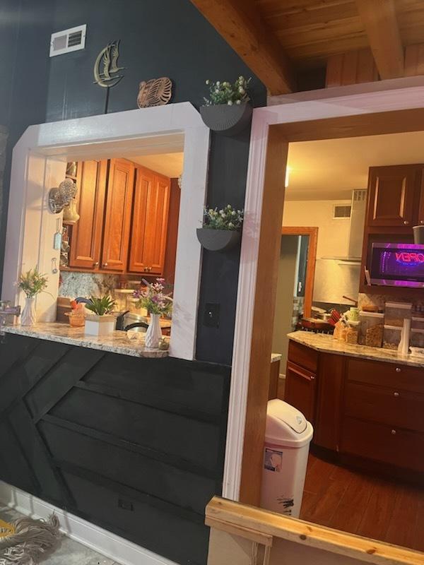 bathroom featuring tile patterned floors, a shower with door, and vanity