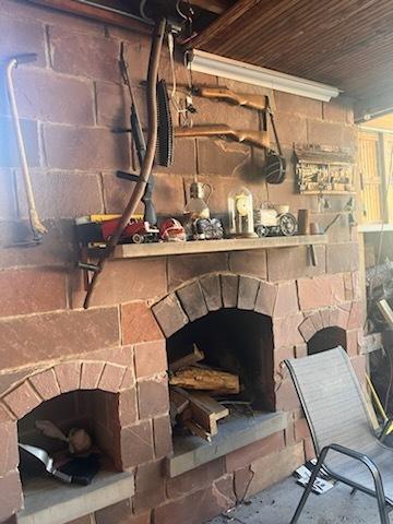 room details featuring wood ceiling and a fireplace