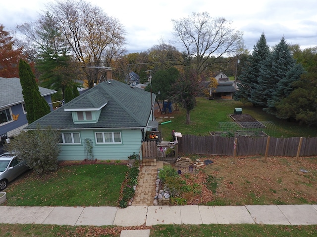 exterior space with a deck and a front yard