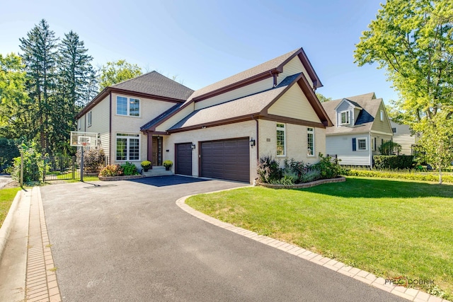 view of front of home with a garage and a front yard