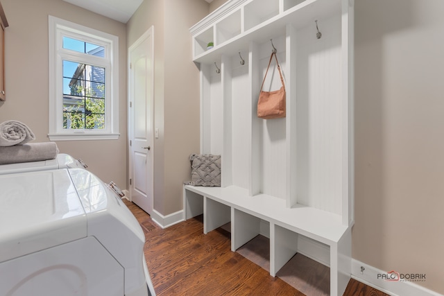 laundry room featuring dark wood-type flooring and washer and dryer