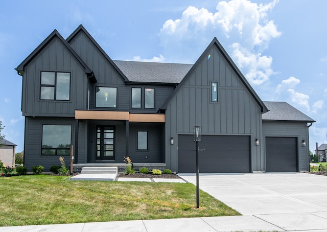 modern farmhouse style home featuring a front yard