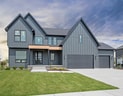 view of front facade featuring a front lawn and a garage