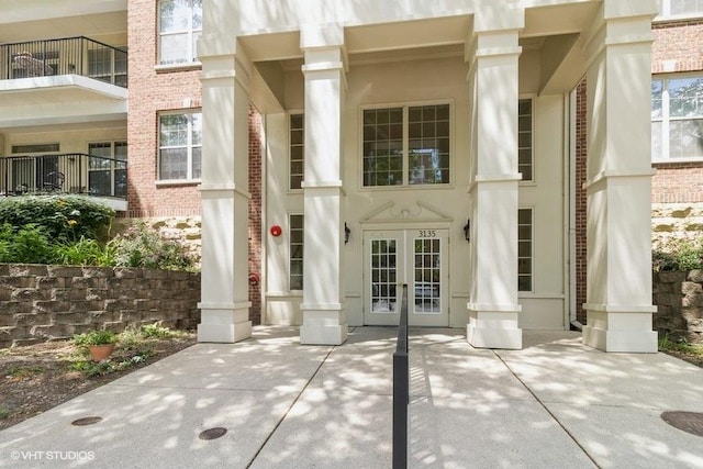 3135 Town Square Dr Unit 106, Rolling Meadows, IL 60008 - view of exterior entry with french doors and brick siding