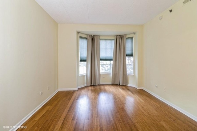 3135 Town Square Dr Unit 106, Rolling Meadows, IL 60008 - unfurnished room with wood finished floors and baseboards
