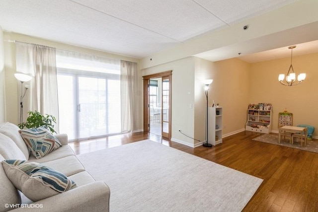 3135 Town Square Dr Unit 106, Rolling Meadows, IL 60008 - living area with a chandelier and wood finished floors