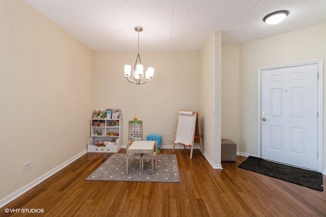 3135 Town Square Dr Unit 106, Rolling Meadows, IL 60008 - sitting room with wood finished floors and a chandelier