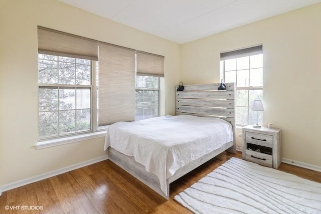 3135 Town Square Dr Unit 106, Rolling Meadows, IL 60008 - bedroom with baseboards and wood finished floors