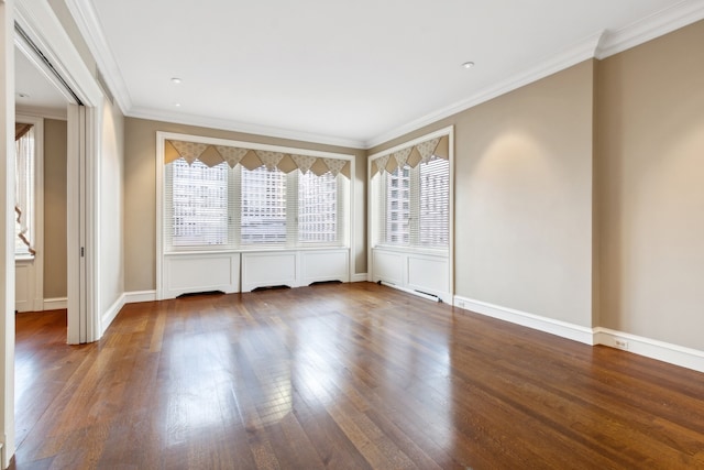 empty room with ornamental molding and dark wood-type flooring