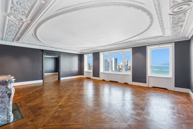 unfurnished living room with parquet flooring and crown molding