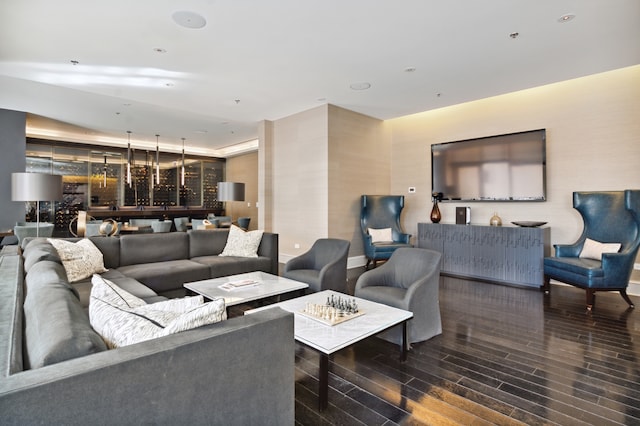 living room with dark hardwood / wood-style flooring