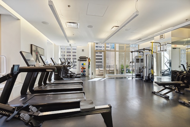 gym featuring floor to ceiling windows