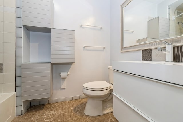 full bathroom featuring toilet, vanity, tile patterned floors, and separate shower and tub