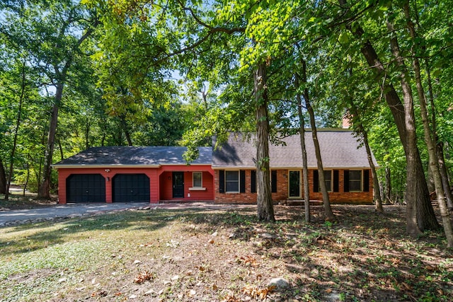 single story home featuring a garage