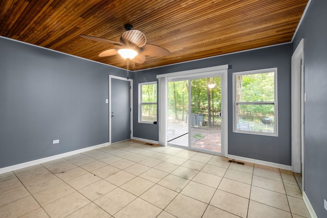 empty room with light tile patterned floors, wooden ceiling, and ceiling fan