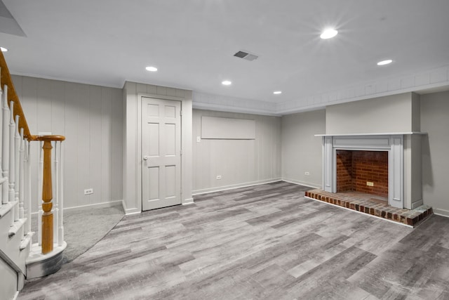 basement with light hardwood / wood-style floors