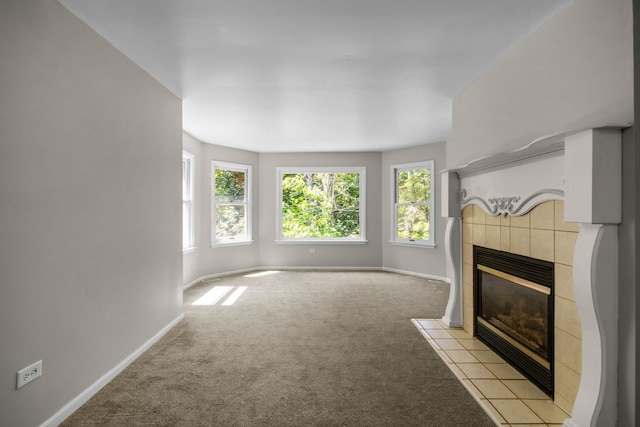 unfurnished living room with a fireplace and light colored carpet