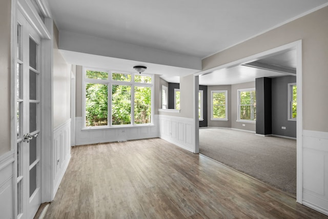 unfurnished room with hardwood / wood-style floors