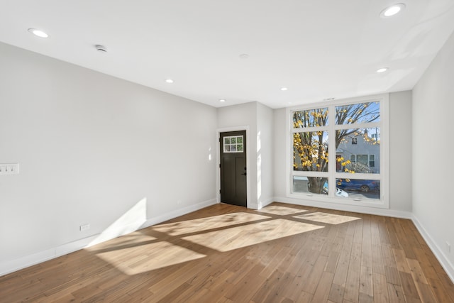 unfurnished living room featuring light hardwood / wood-style floors