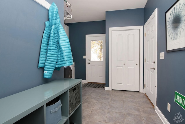 mudroom with light tile patterned flooring