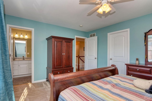 bedroom with connected bathroom, light colored carpet, ceiling fan, and sink