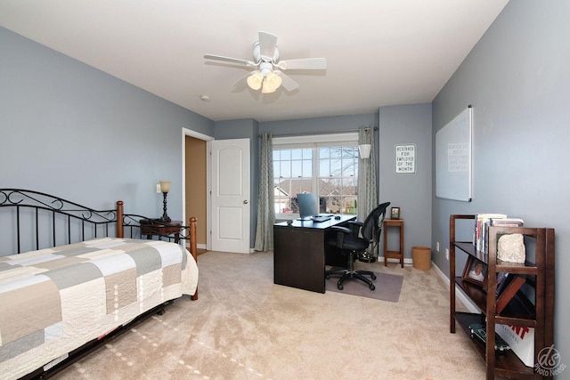 bedroom with ceiling fan and light carpet