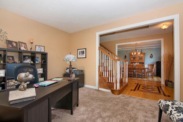 office area with carpet flooring and a chandelier