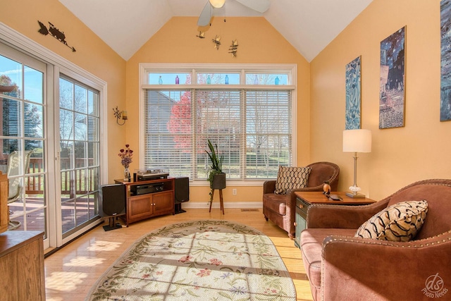 sitting room featuring ceiling fan, light hardwood / wood-style flooring, and vaulted ceiling