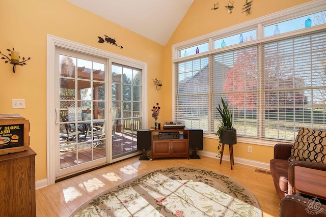 interior space with hardwood / wood-style floors and lofted ceiling