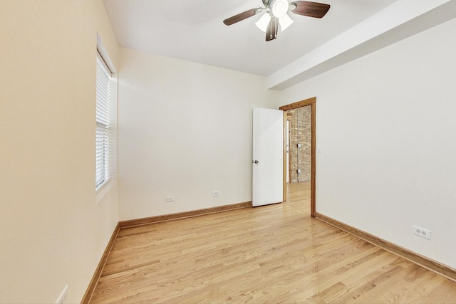 spare room with light hardwood / wood-style flooring and ceiling fan