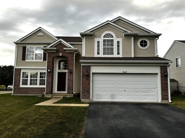 view of front of property with a garage and a front lawn