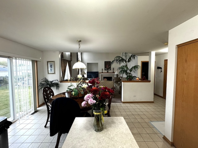 dining area featuring light tile patterned floors