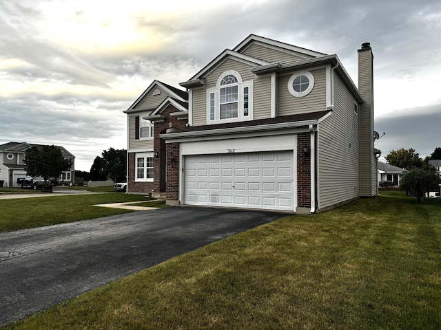 view of property with a garage and a front yard