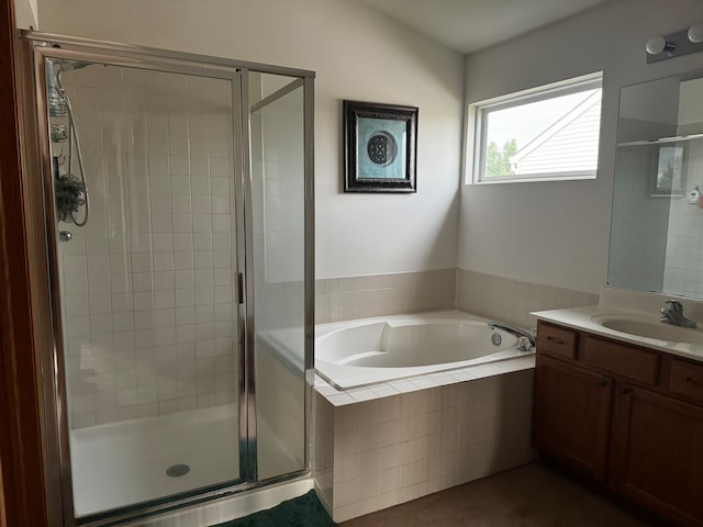 bathroom featuring vanity and separate shower and tub